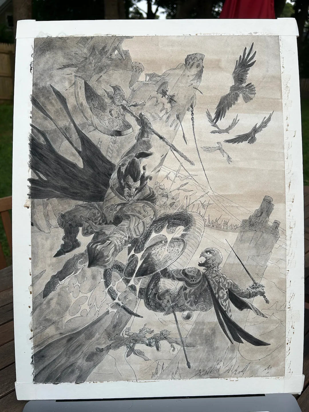 A detailed fantasy battle scene with armored warriors fighting on a rocky landscape, flying birds, and a castle in the background, depicted in grayscale.